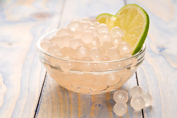 Image showing tapioca pearls with lime. white bubble tea ingredients