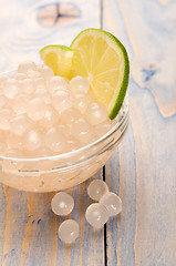 Image showing tapioca pearls with lime. white bubble tea ingredients