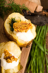 Image showing Baked potato with sour cream, grain Dijon mustard and herbs