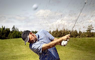 Image showing golfer shooting a golf ball 