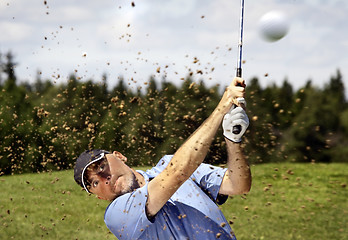 Image showing golfer shooting a golf ball