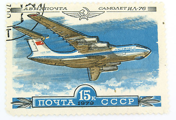 Image showing A vintage canselled stamp with a plane