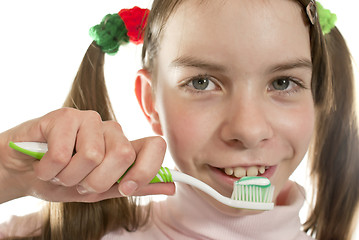 Image showing Teen girl with toothbrush isolated on white