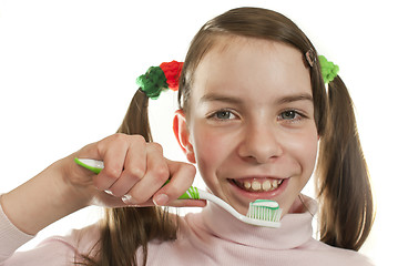 Image showing Teen girl with toothbrush isolated on white