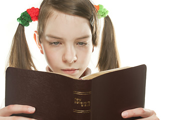Image showing Teen girl reading the Bible isolated on white