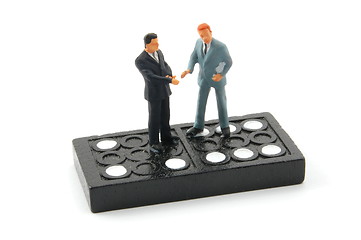 Image showing business man on domino isolated