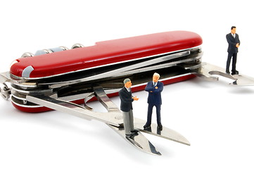 Image showing business people on penknife