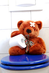 Image showing toy teddy bear on wc toilet