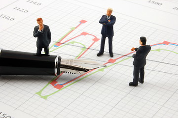 Image showing business people on chart background