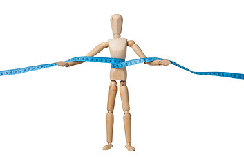 Image showing Mannequin holding a measuring tape
