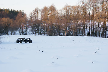 Image showing A winter rustical field with an old wagon