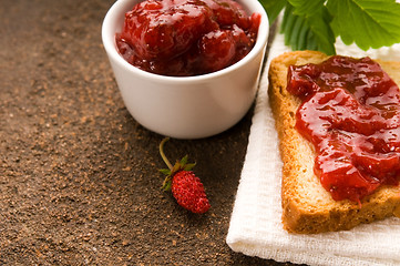 Image showing Wild strawberry jam with toast