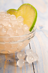 Image showing tapioca pearls with lime. white bubble tea ingredients