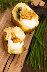 Image showing Baked potato with sour cream, grain Dijon mustard and herbs