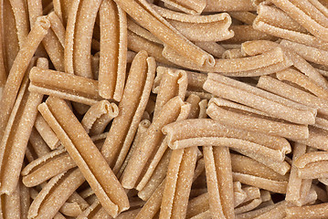 Image showing Food background: uncooked bran pasta