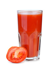 Image showing Drinking glass with tomato juice and ripe fresh tomato near