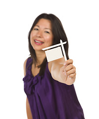 Image showing Multiethnic Woman Holding Small Blank Real Estate Sign in Hand