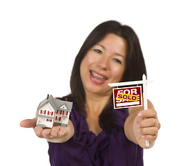 Image showing Multiethnic Woman Holding Small Sold For Sale Real Estate Sign a