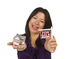 Image showing Multiethnic Woman Holding Small For Sale Real Estate Sign and Ho