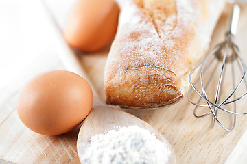 Image showing bread, flour, eggs and kitchen utensil