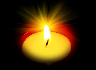 Image showing burning candle in the dark