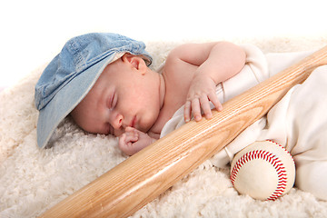 Image showing Baby Boy Sleeping With a Baseball Bat and Ball