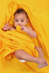 Image showing Cute Ethnic Baby Holding a Rubber Duckie