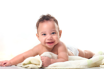 Image showing Curly Haired Baby Boy on Stomach With Blankets