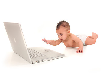 Image showing Infant Boy Playing With a Laptop Computer