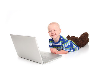 Image showing Little Boy Learning to Use a Laptop Computer