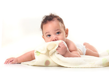 Image showing Infant Boy on Stomach Playing With Blankets