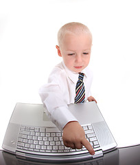 Image showing Little Boy in a Suit Working on a Laptop Computer