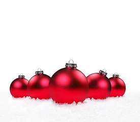 Image showing Holiday Ornaments Lying in the Snow