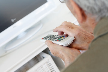 Image showing Senior man watching tv