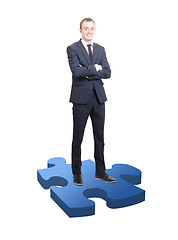 Image showing Businessman on puzzle piece