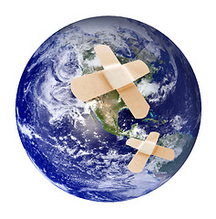 Image showing Wounded earth with bandaid