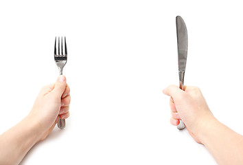 Image showing Hands holding knife and fork