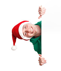 Image showing Guy with santa hat and sign