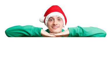 Image showing Guy with santa hat and sign