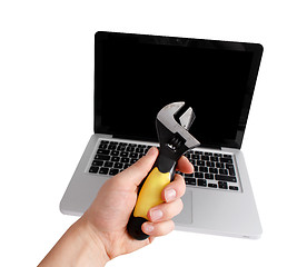 Image showing Man fixing computer