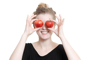 Image showing A girl with apples