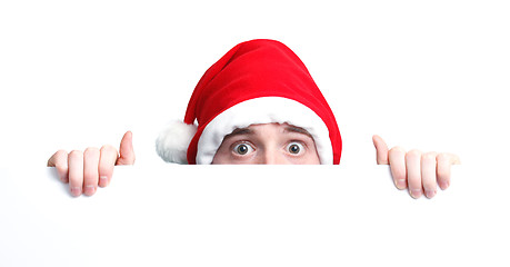 Image showing Guy with santa hat and sign