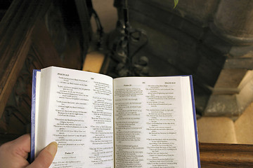 Image showing person reading from the psalms in  the bible