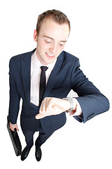 Image showing Business man consulting watch