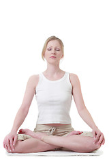 Image showing Woman sitting crossed legged