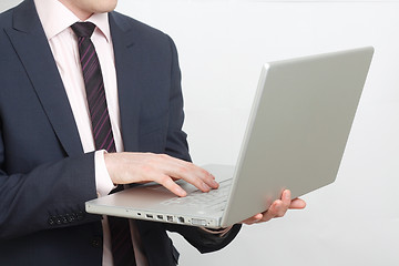 Image showing Business man with laptop