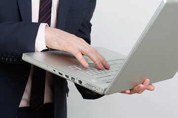 Image showing Business man with laptop