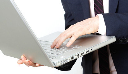 Image showing Business man with laptop typing