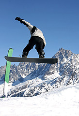 Image showing Snowboarder jumping