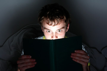 Image showing Reading at night